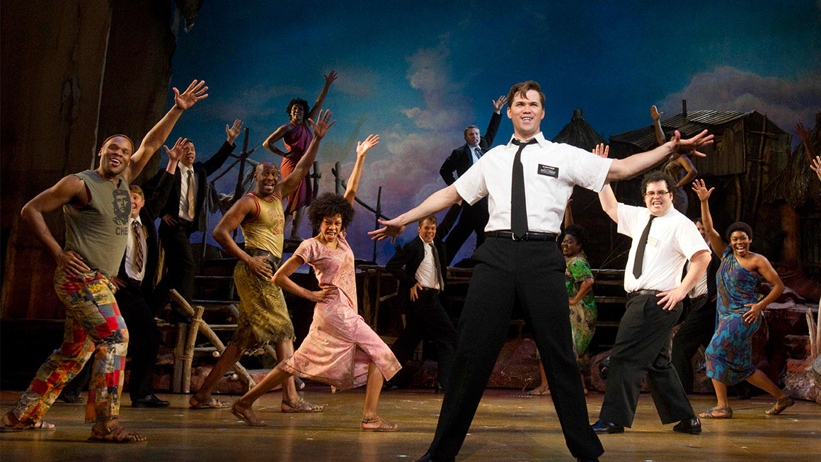 Andrew Rannells and the cast of <em>The Book of Mormon</em>.